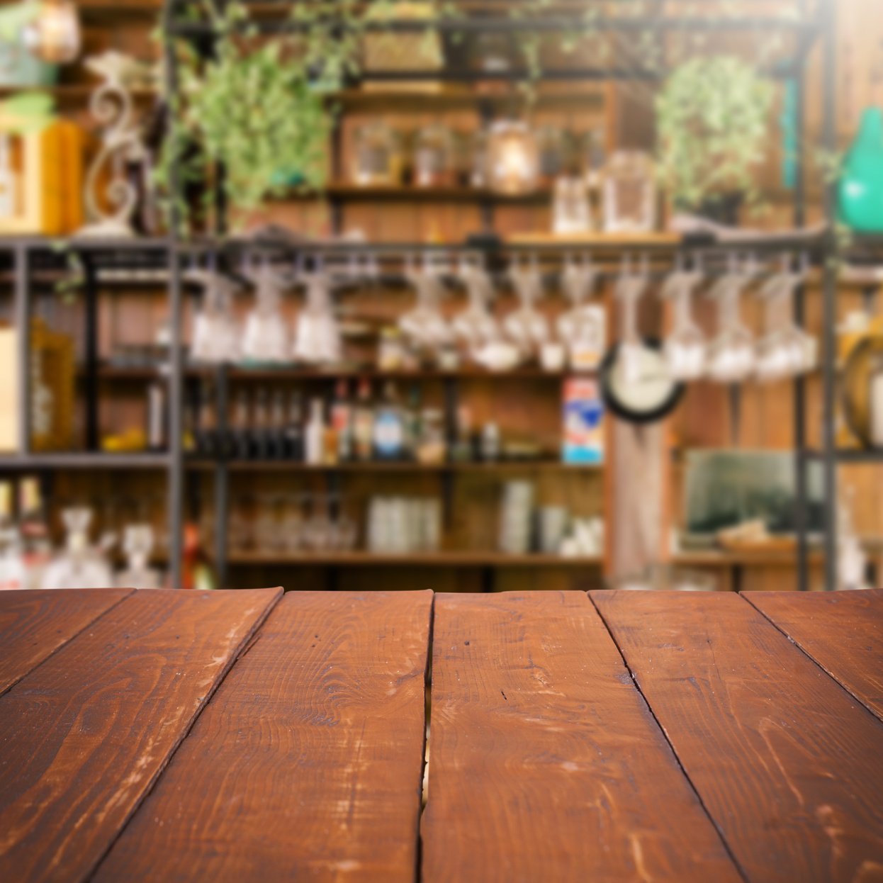 Empty wooden table and blurred kitchen background